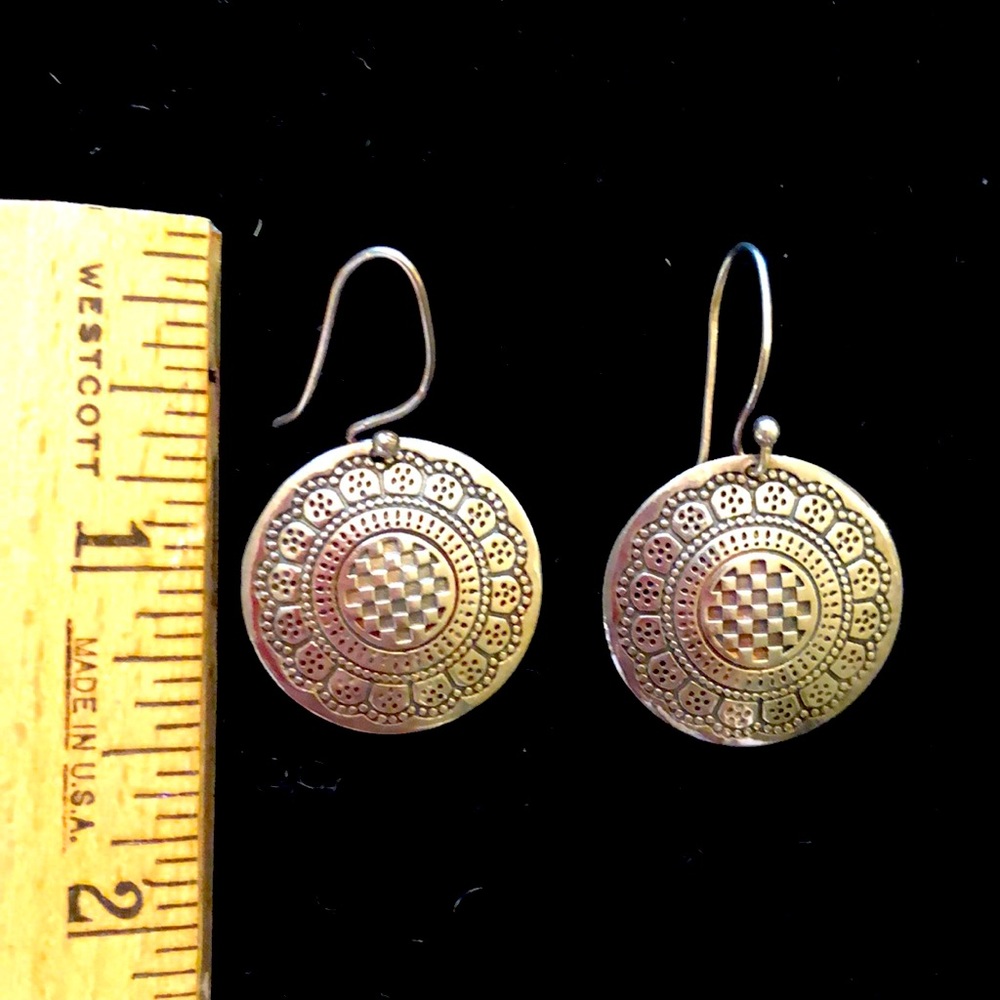 Sterling silver beautifully designed disk earrings.